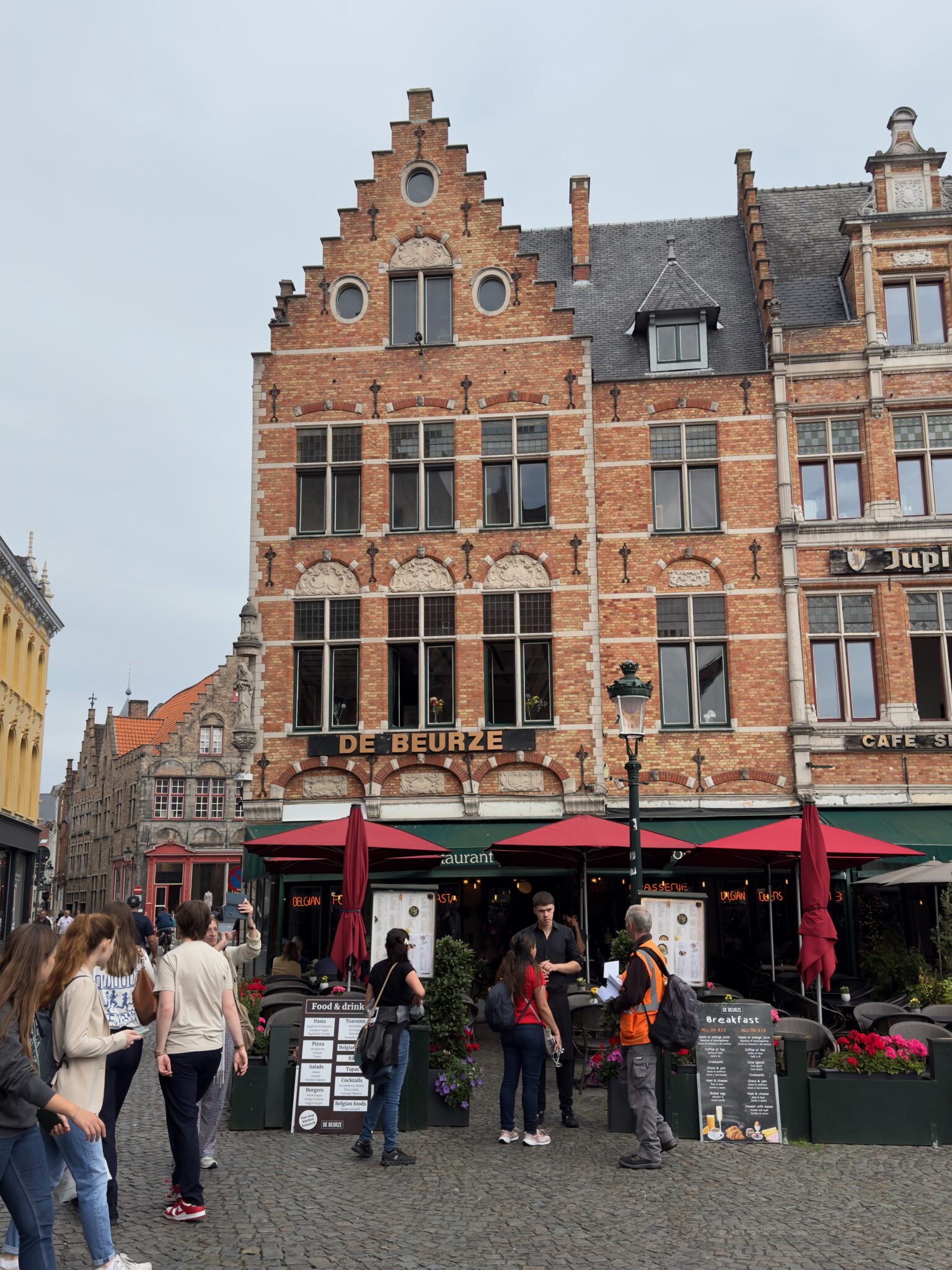 Brick front facade of the Der Beurze inn in Bruges