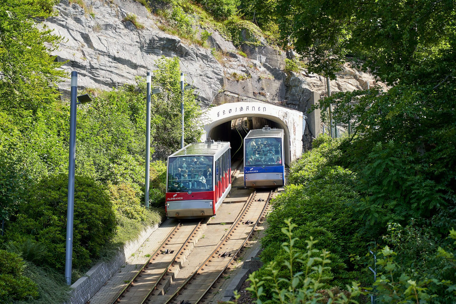 Picture of 2 funiculars passing one another before a tunnel at Mount Floyen Bergen